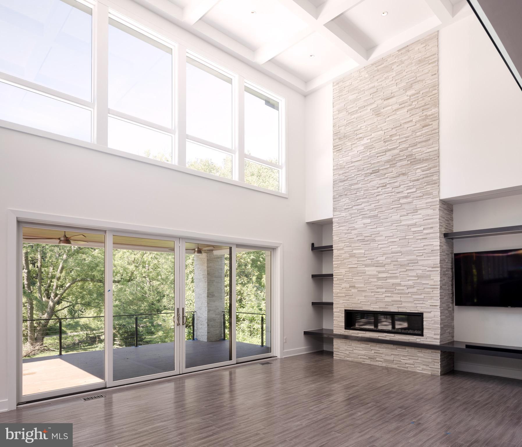 1217 Crest Lane McLean, VA 22101 - Photo 9 of 28 a view of an empty room with wooden floor and a window