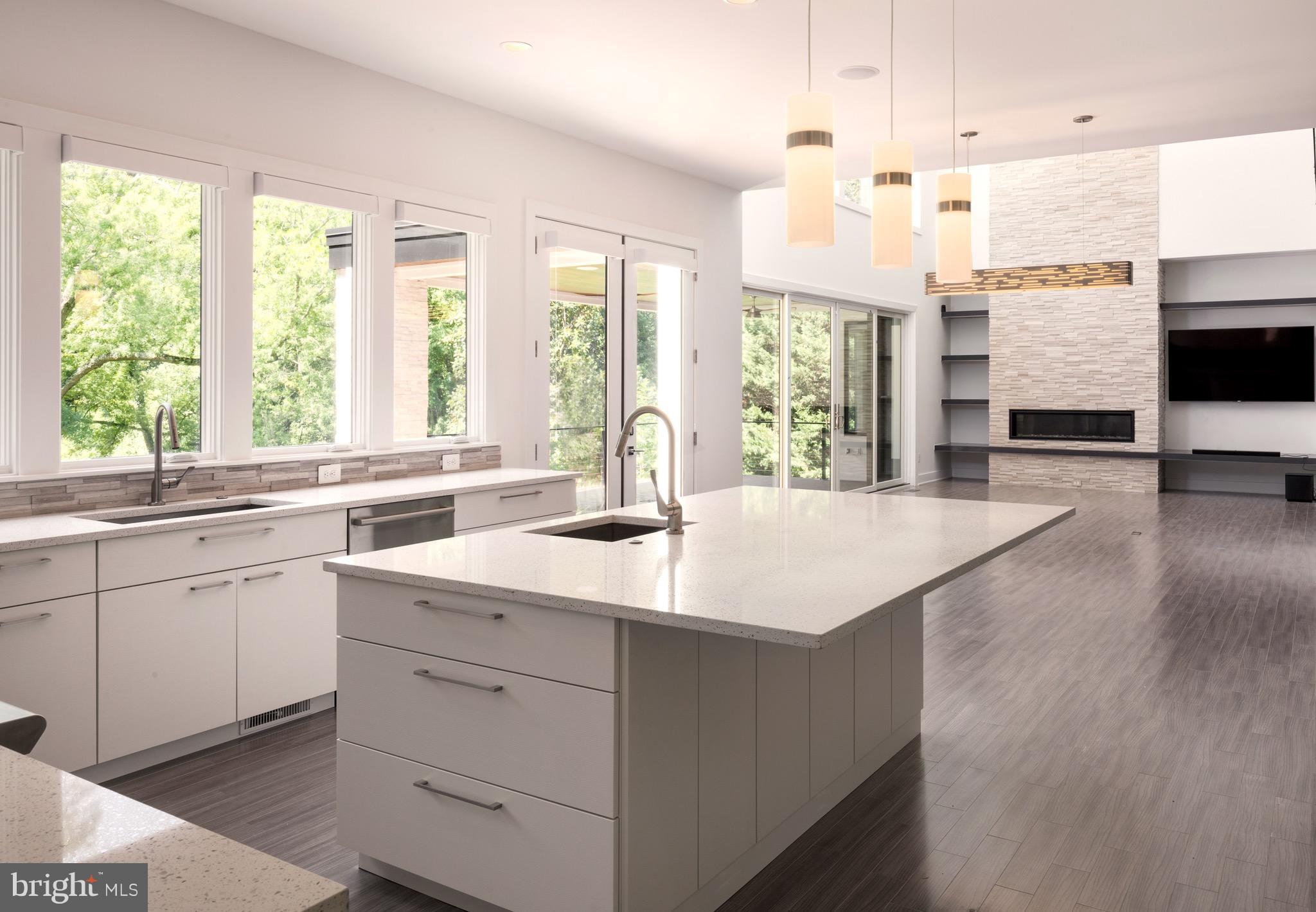 1217 Crest Lane McLean, VA 22101 - Photo 12 of 28 a kitchen with counter top space sink and living room