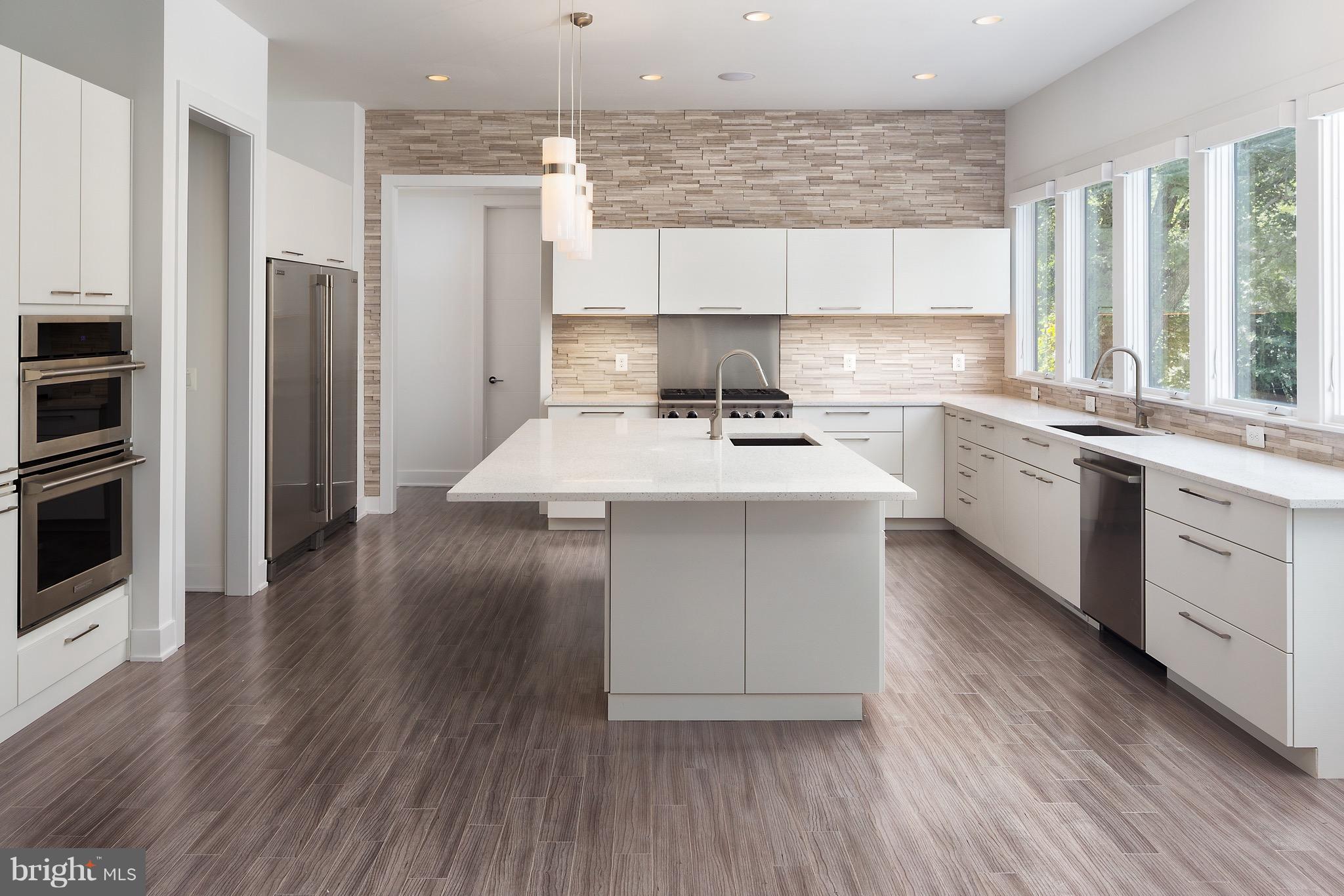 1217 Crest Lane McLean, VA 22101 - Photo 14 of 28 a kitchen with a sink stove and refrigerator