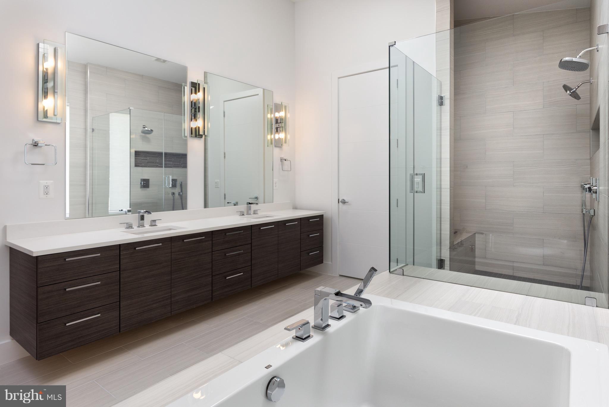 1217 Crest Lane McLean, VA 22101 - Photo 21 of 28 a bathroom with a tub sink shower and mirror