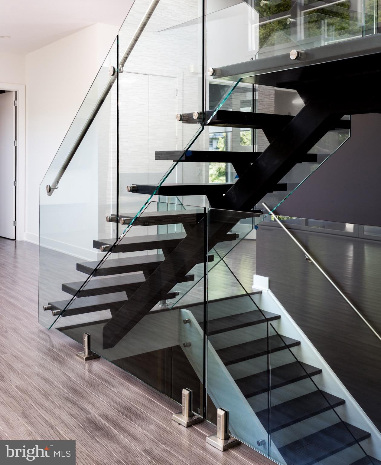 1217 Crest Lane McLean, VA 22101 - Photo 24 of 28 a view of entryway and hall with wooden floor
