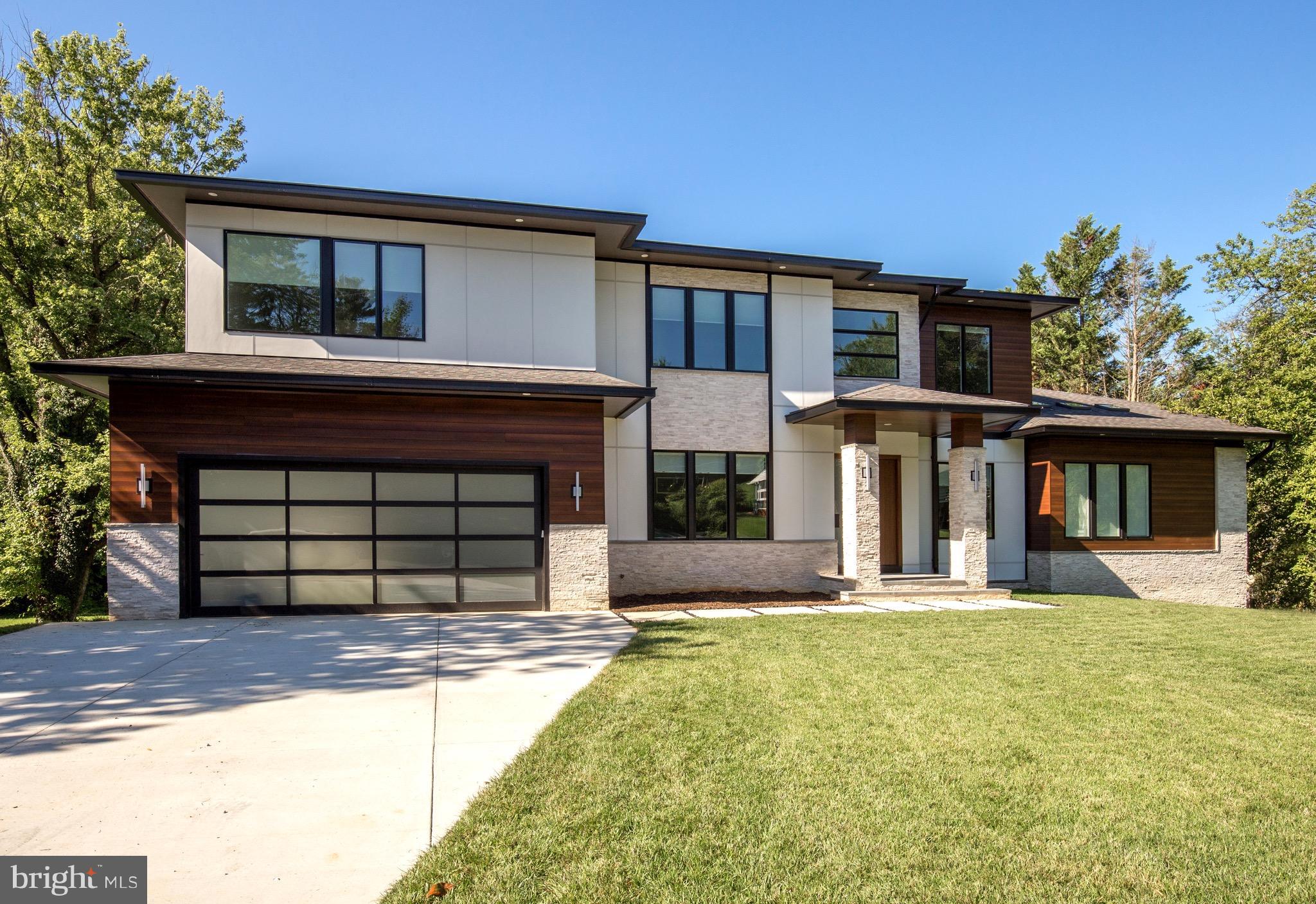 1217 Crest Lane McLean, VA 22101 - Photo 6 of 28 a front view of a house with a yard