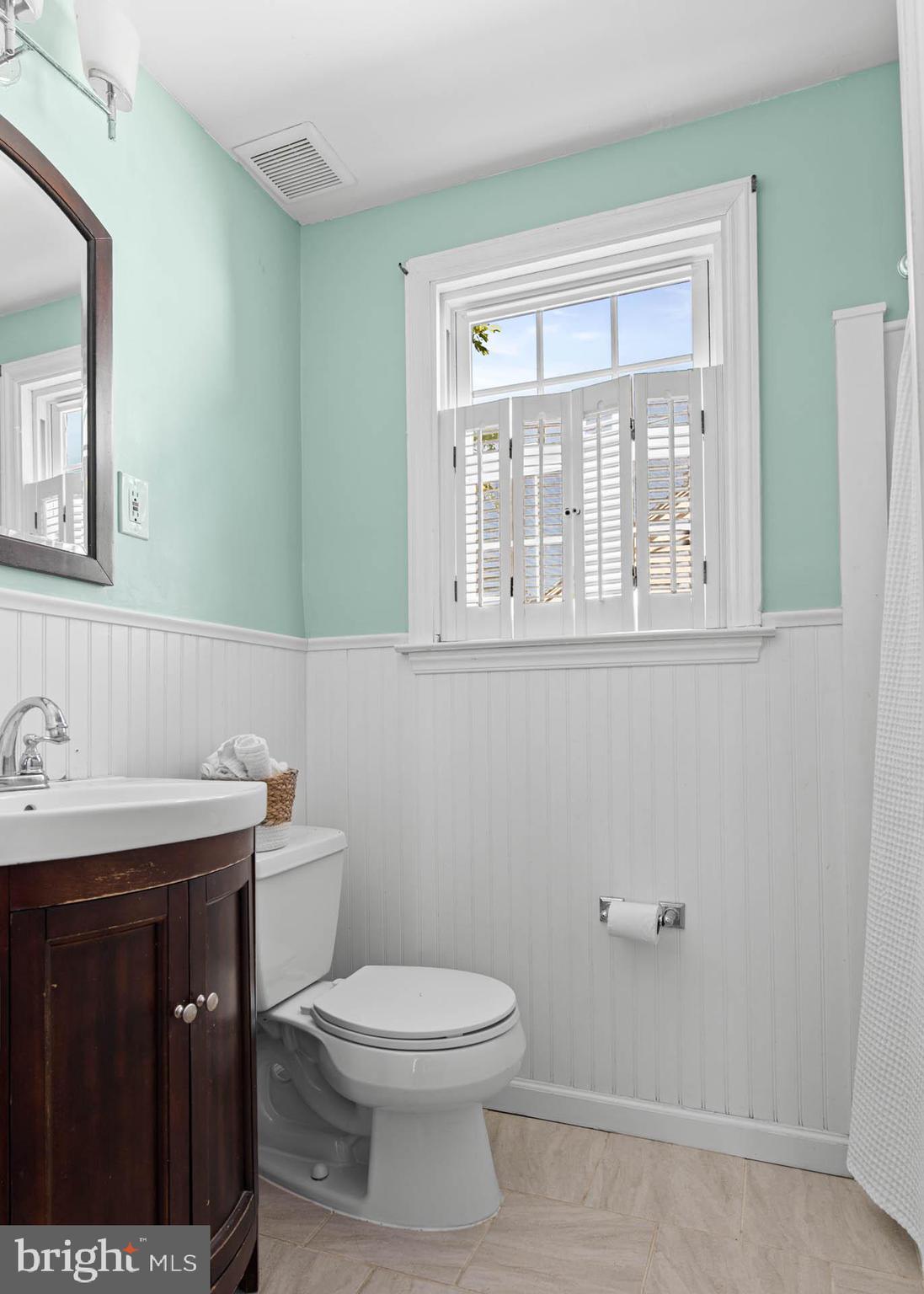 224 Wayne Avenue Springfield, PA 19064 - Photo 17 of 27 a bathroom with a toilet a sink and a mirror