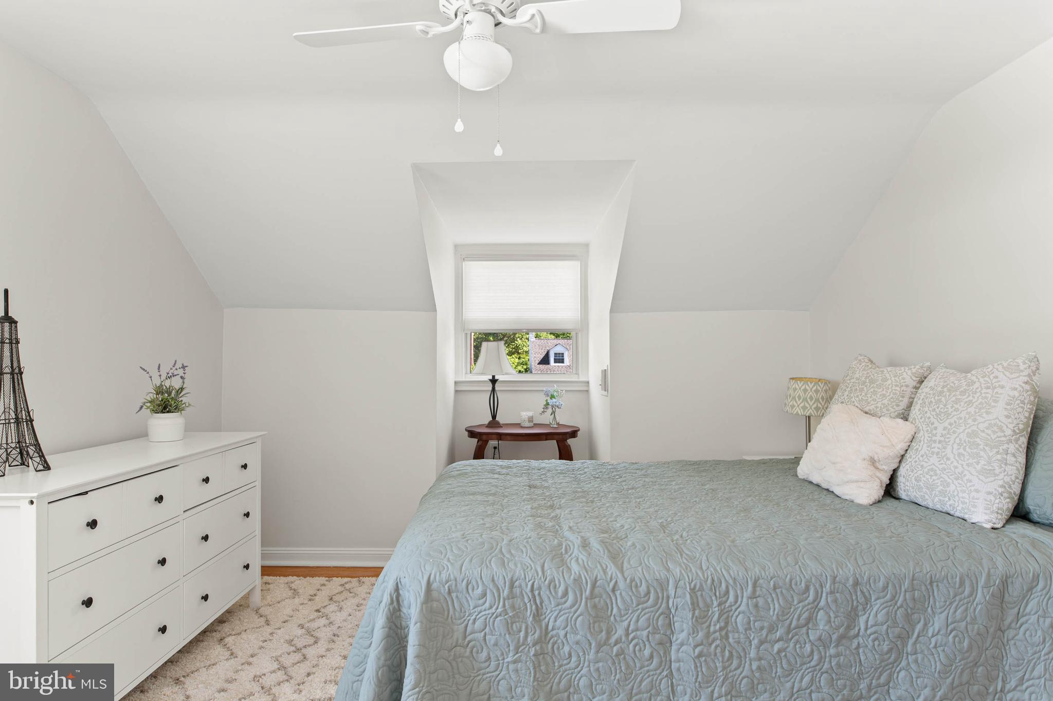 224 Wayne Avenue Springfield, PA 19064 - Photo 21 of 27 a bedroom with a bed and a chandelier