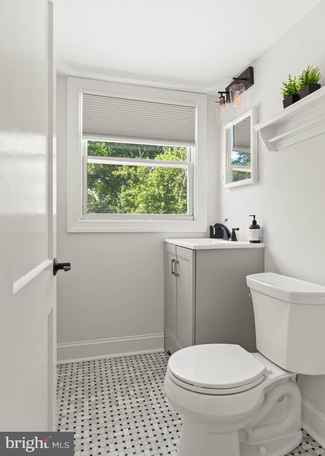 224 Wayne Avenue Springfield, PA 19064 - Photo 22 of 27 a bathroom with a toilet a window and a shower