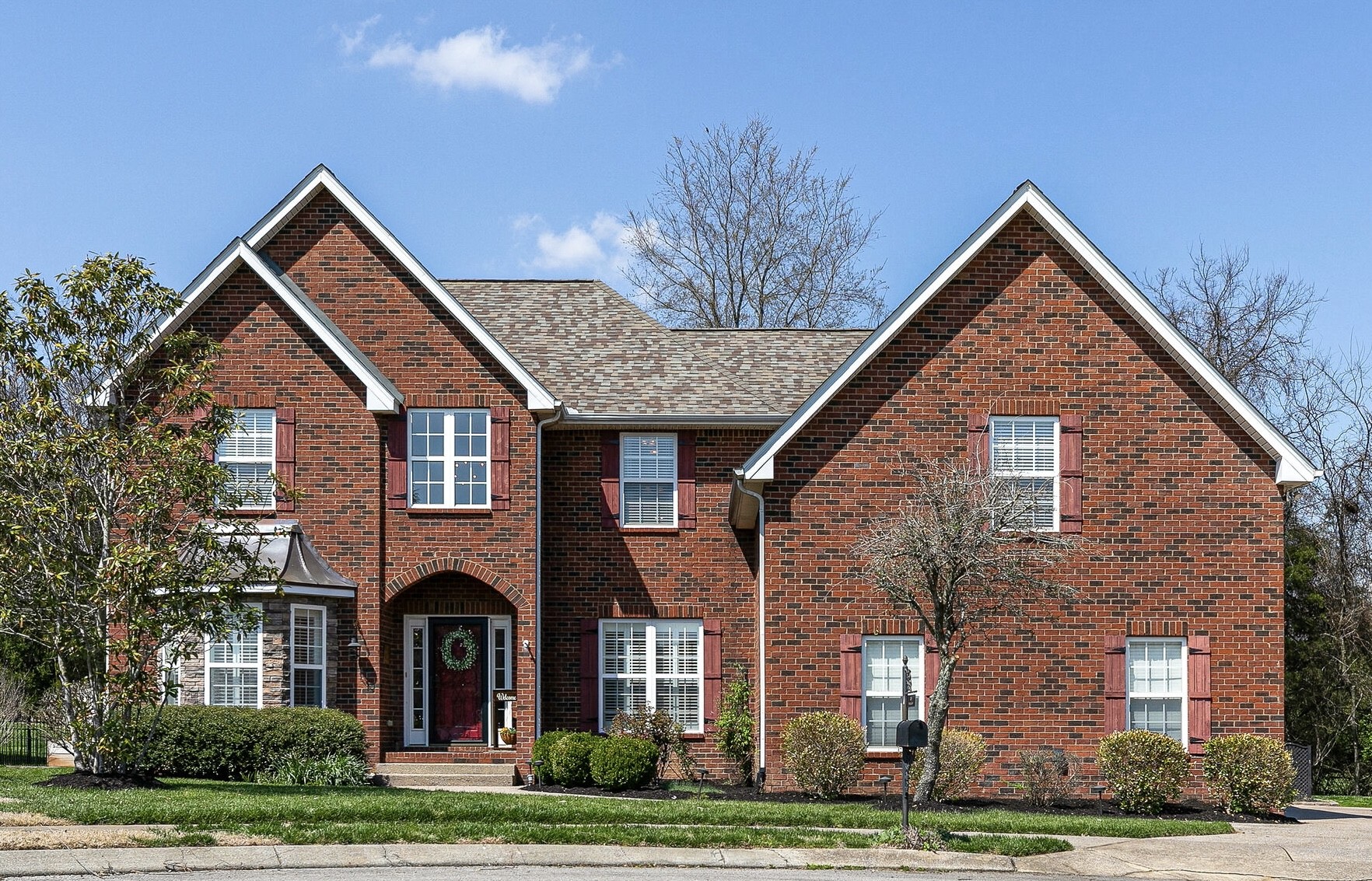 2003 Eylandt Court Spring Hill, TN 37174 - Photo 1 of 33 a front view of a house with a yard