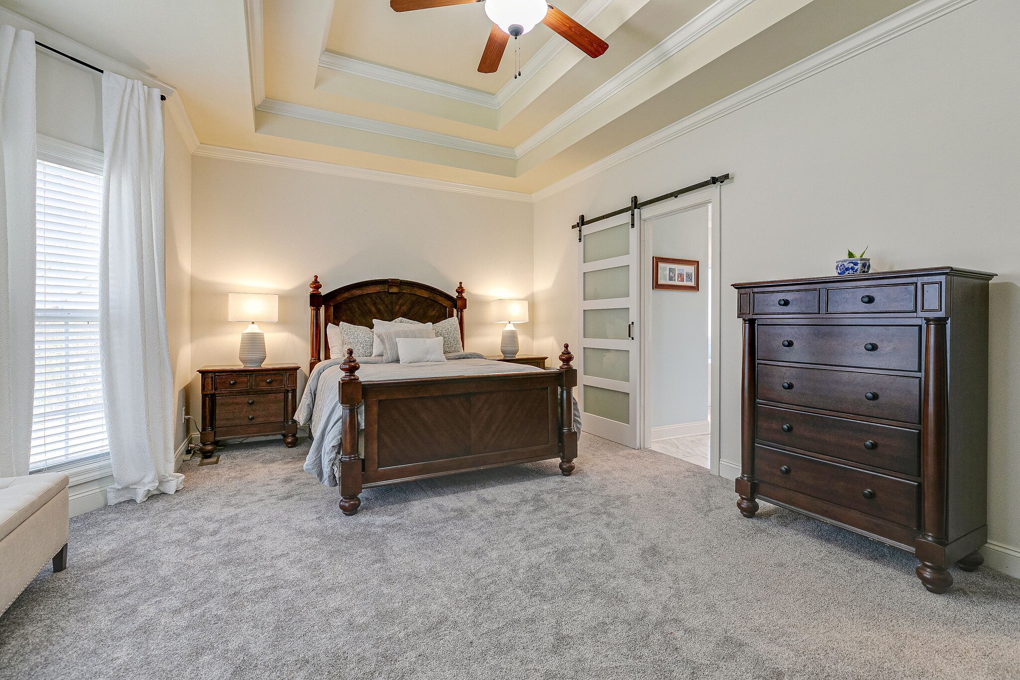 2003 Eylandt Court Spring Hill, TN 37174 - Photo 15 of 33 a bedroom with a bed and a chandelier