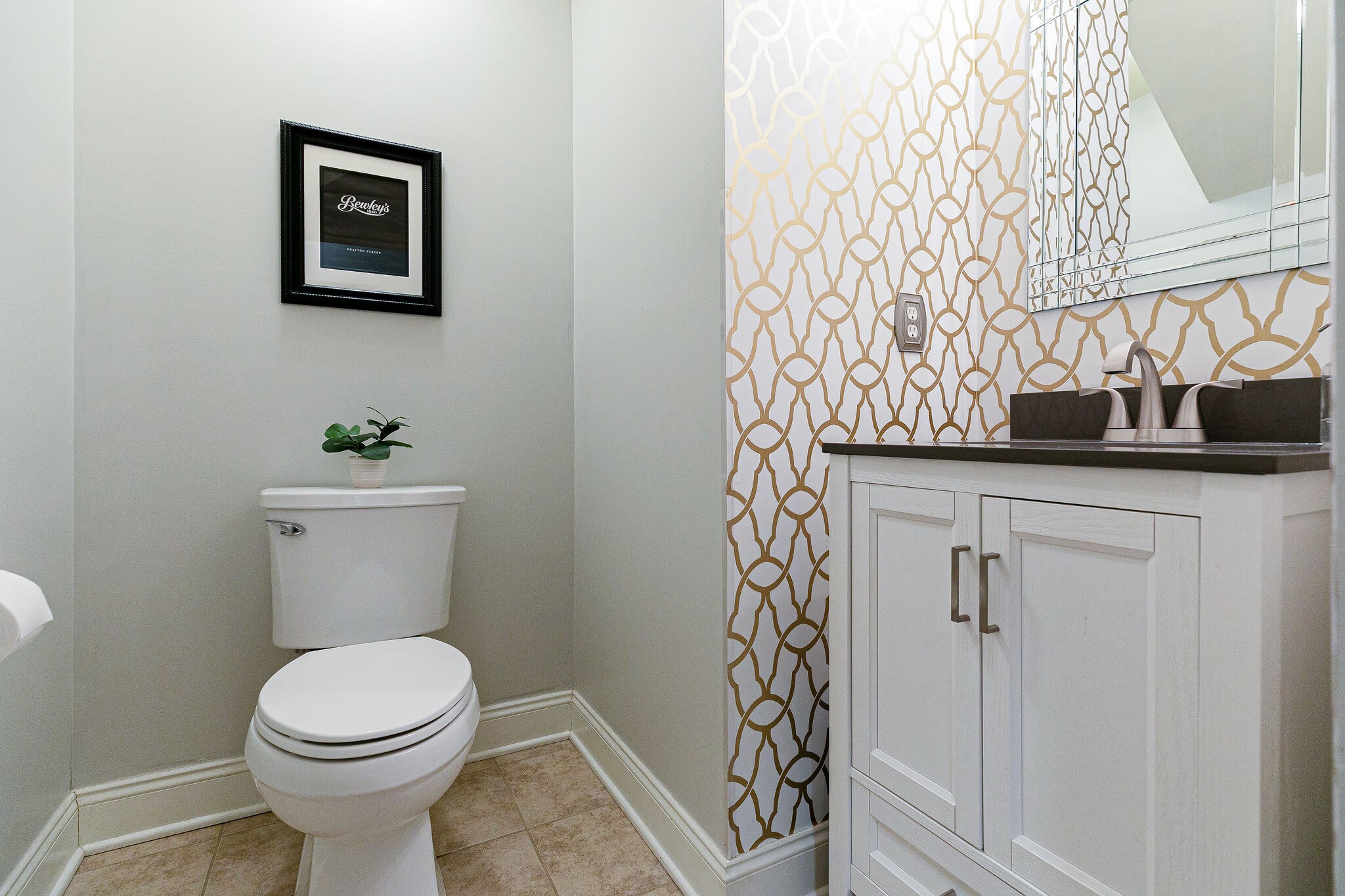 2003 Eylandt Court Spring Hill, TN 37174 - Photo 19 of 33 a bathroom with a toilet sink and vanity