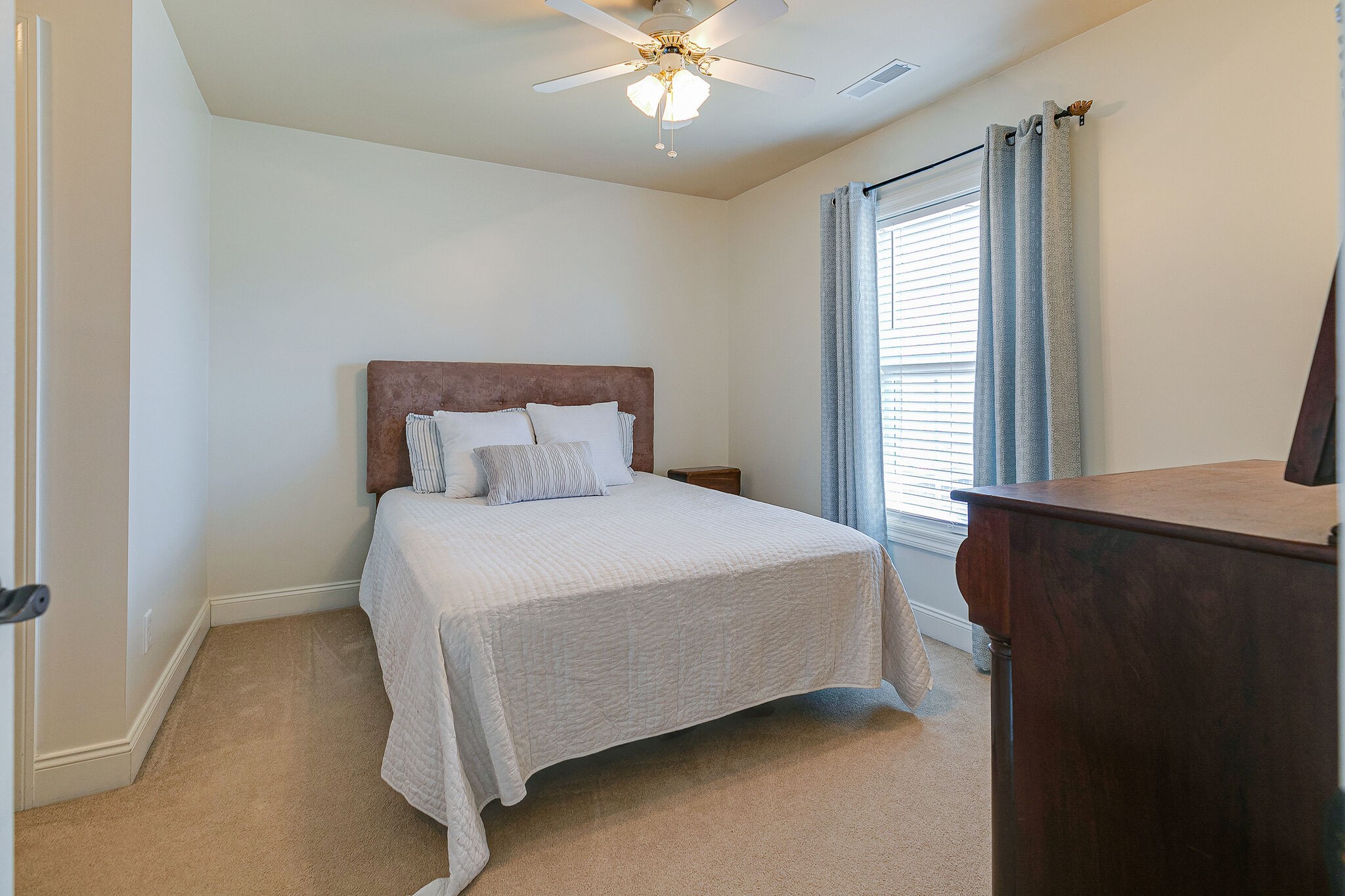 2003 Eylandt Court Spring Hill, TN 37174 - Photo 22 of 33 a bedroom with a bed and a chandelier
