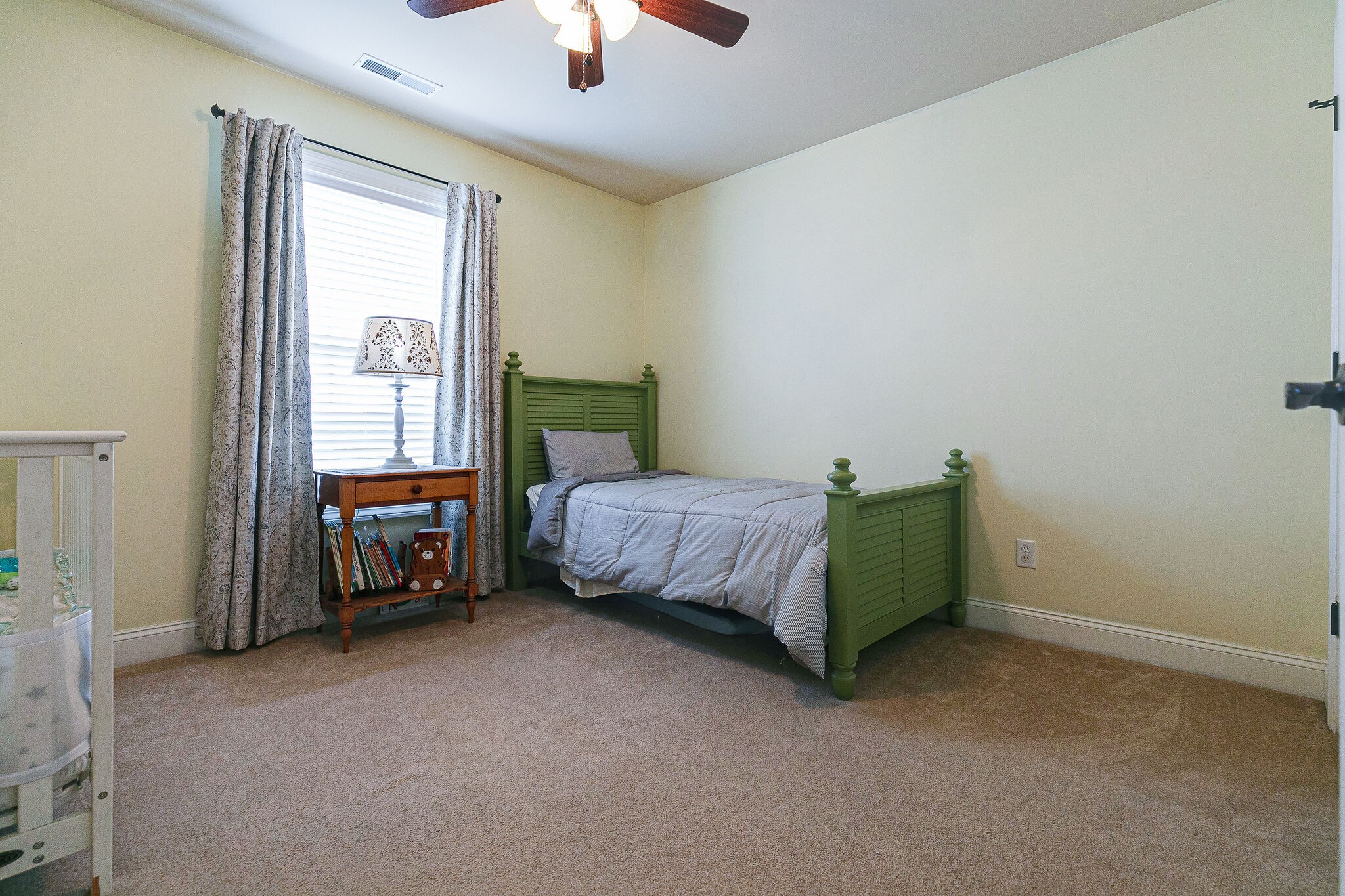 2003 Eylandt Court Spring Hill, TN 37174 - Photo 25 of 33 a bedroom with a bed and a chandelier