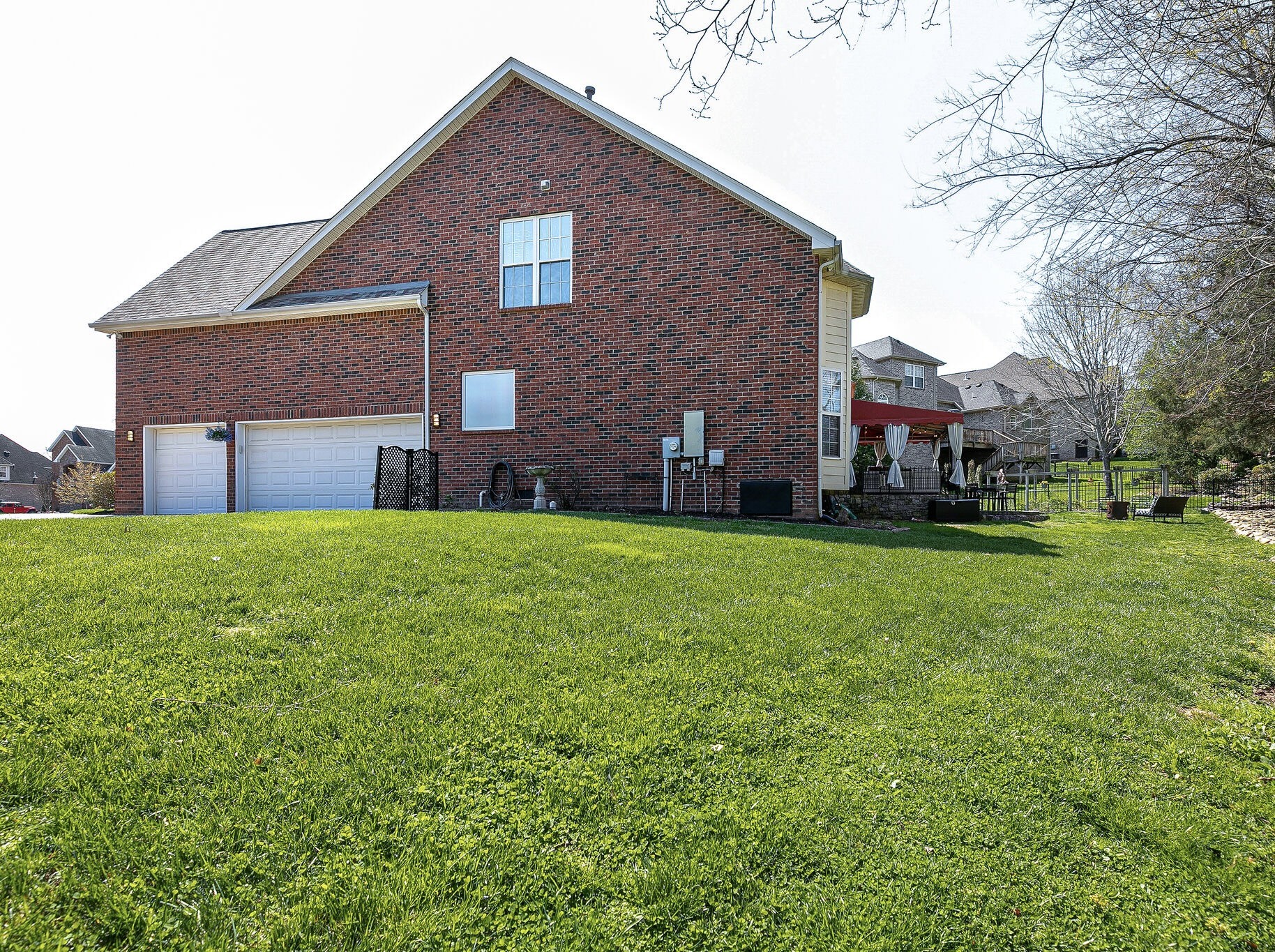 2003 Eylandt Court Spring Hill, TN 37174 - Photo 32 of 33 a brick house with a big yard plants and big trees