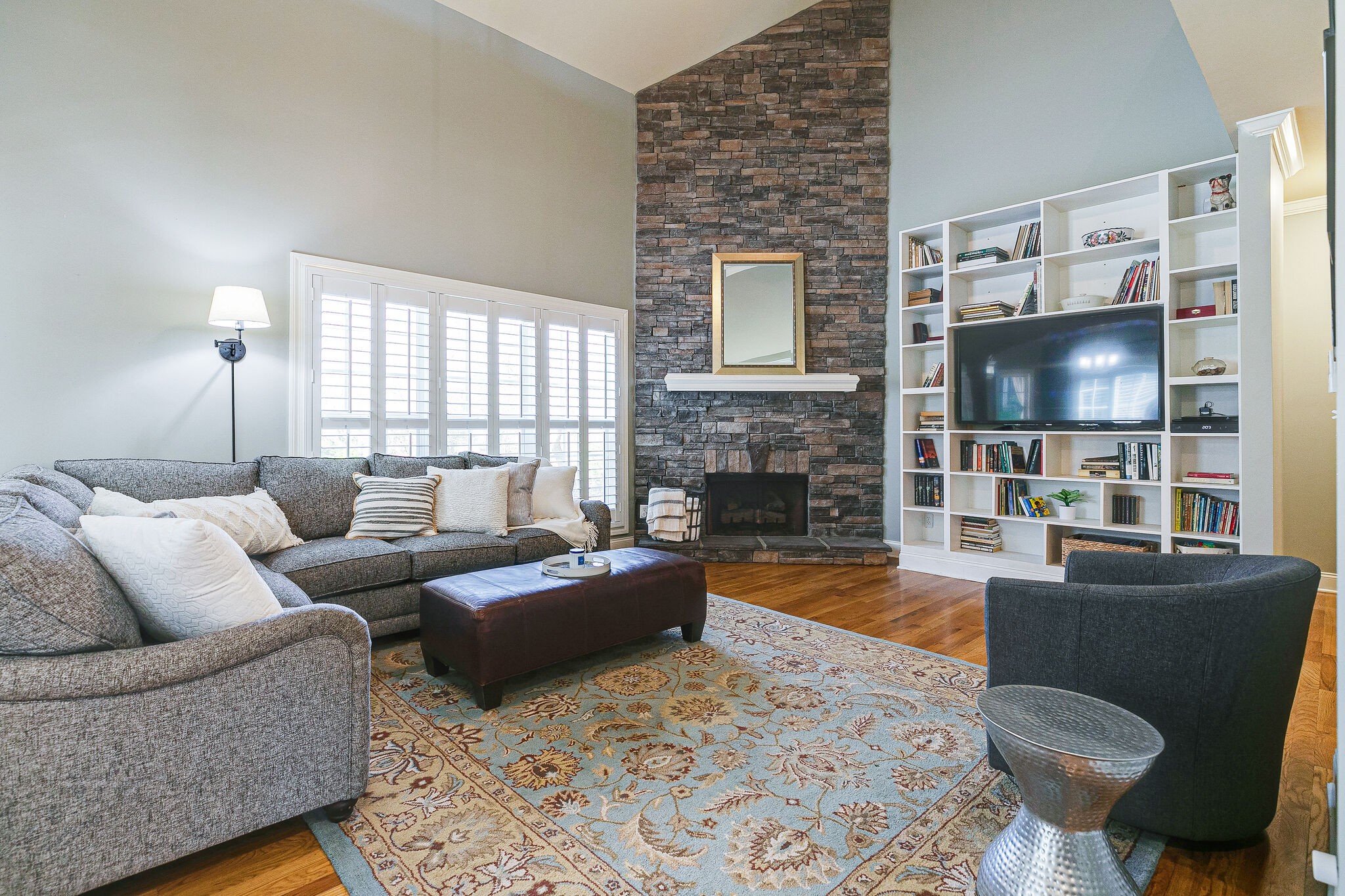 2003 Eylandt Court Spring Hill, TN 37174 - Photo 4 of 33 a living room with fireplace furniture and a flat screen tv