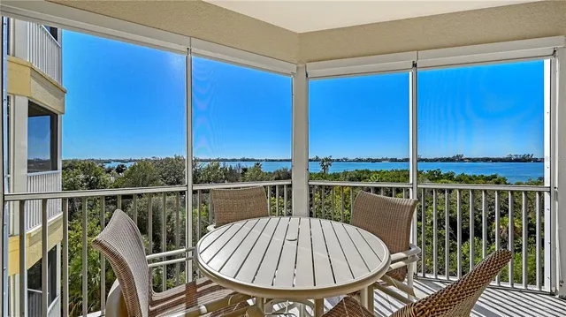 a view of roof deck with chair and wooden floor
