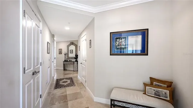 a view of a hallway with workspace and a couch