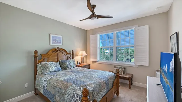 a bedroom with a bed a window and walk in closet