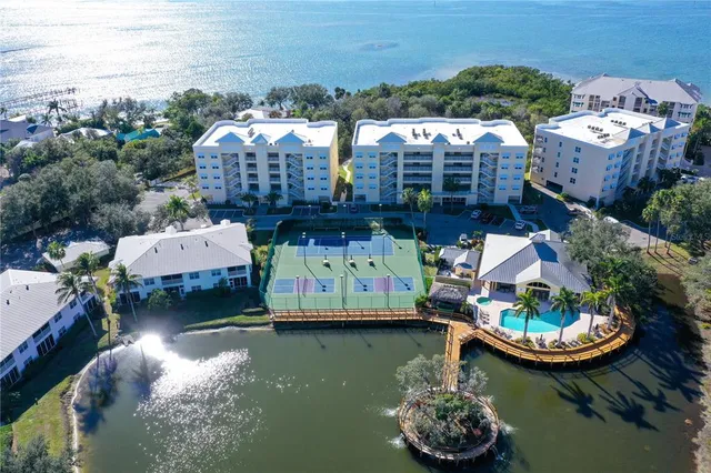 a view of a lake with tall buildings