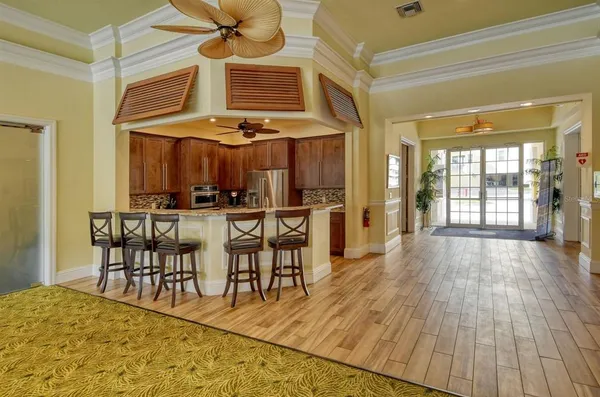 a view of a dining room with furniture and chandelier