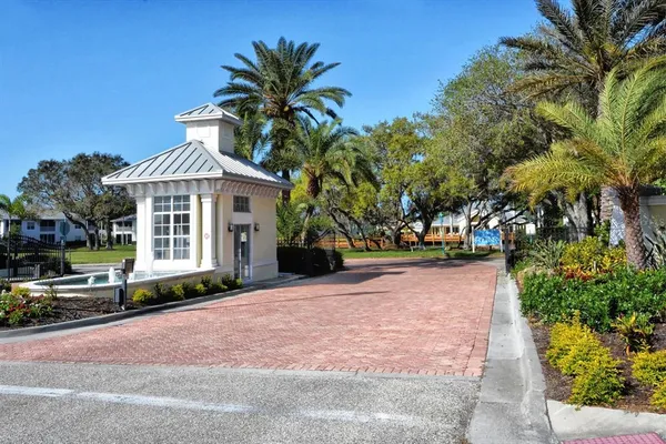 a front view of a house with a yard and a garage