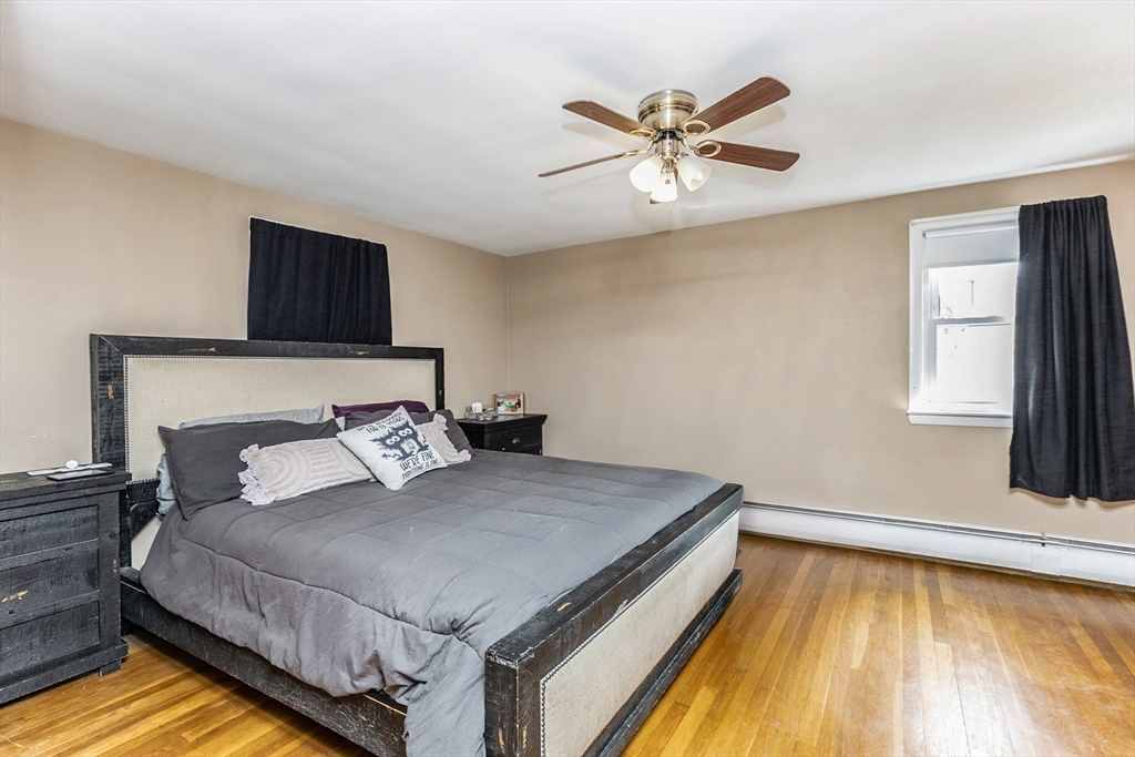52 Albemarle Avenue, Unit 52 Lexington, MA 02420 - Photo 15 of 23 a bedroom with a bed and window