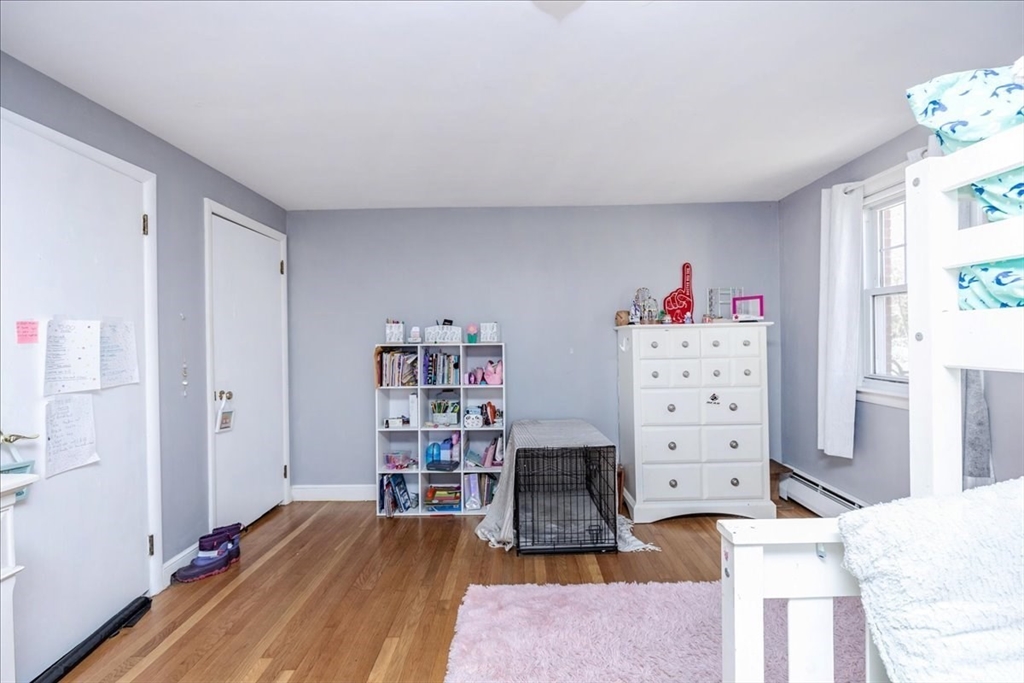 52 Albemarle Avenue, Unit 52 Lexington, MA 02420 - Photo 17 of 23 a living room with furniture and a wooden floor