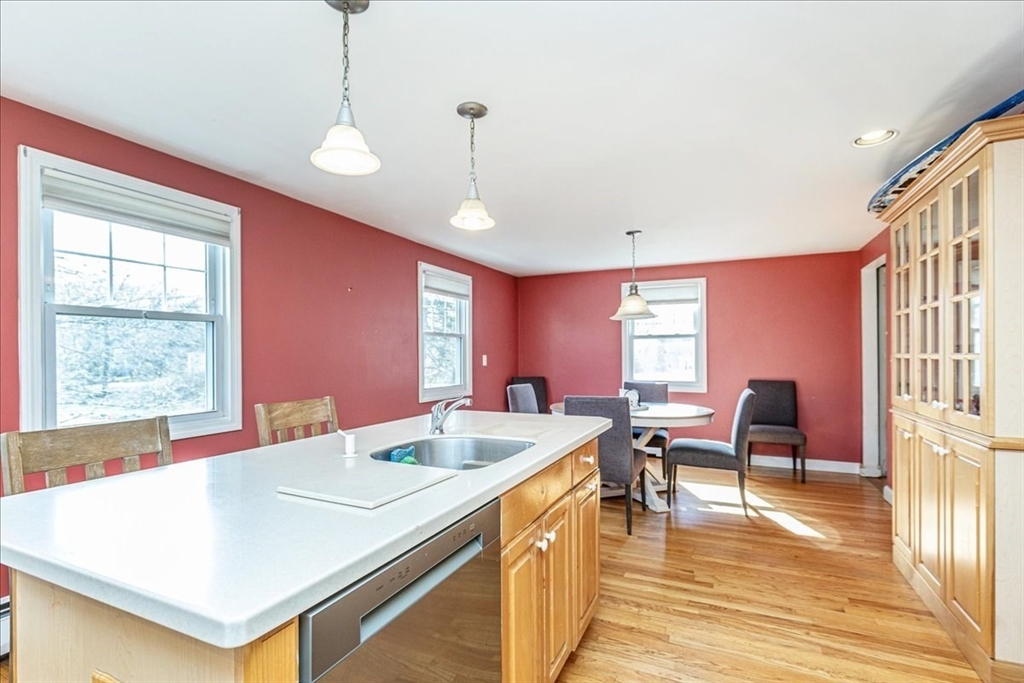 52 Albemarle Avenue, Unit 52 Lexington, MA 02420 - Photo 8 of 23 a view of a dining room with furniture window and wooden floor