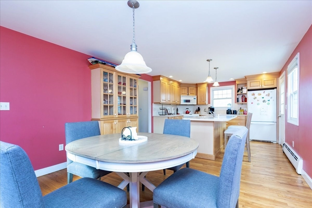 52 Albemarle Avenue, Unit 52 Lexington, MA 02420 - Photo 9 of 23 a view of a dining room with furniture window and wooden floor