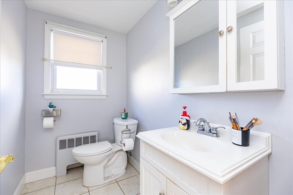 52 Albemarle Avenue, Unit 52 Lexington, MA 02420 - Photo 10 of 23 a white sink sitting next to a white cabinet