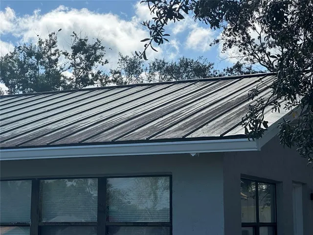 a view of a backyard of the house