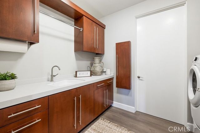 a kitchen with stainless steel appliances granite countertop a sink and a refrigerator