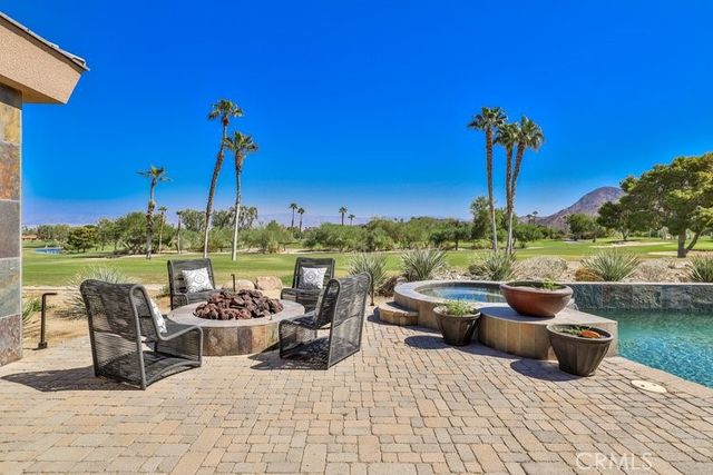 a view of a terrace with furniture