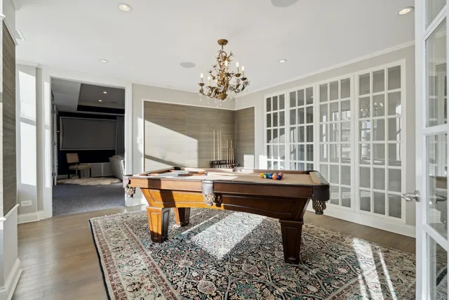 a living room with furniture and floor to ceiling window