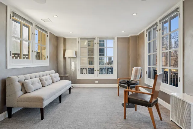 a view of a livingroom with furniture and windows