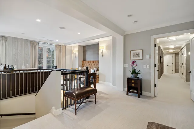 a dining room with stainless steel appliances a table and chairs