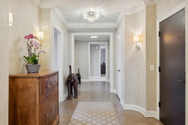 a view of hallway with chandelier