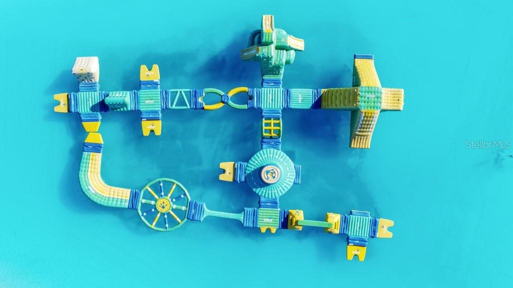 9319 Forge Breeze Loop Wesley Chapel, FL 33545 - Photo 28 of 45 a room with a table and chairs