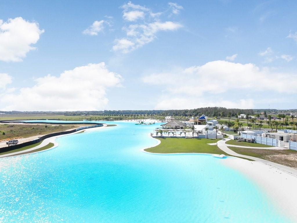 9319 Forge Breeze Loop Wesley Chapel, FL 33545 - Photo 31 of 45 a view of a swimming pool and lake view