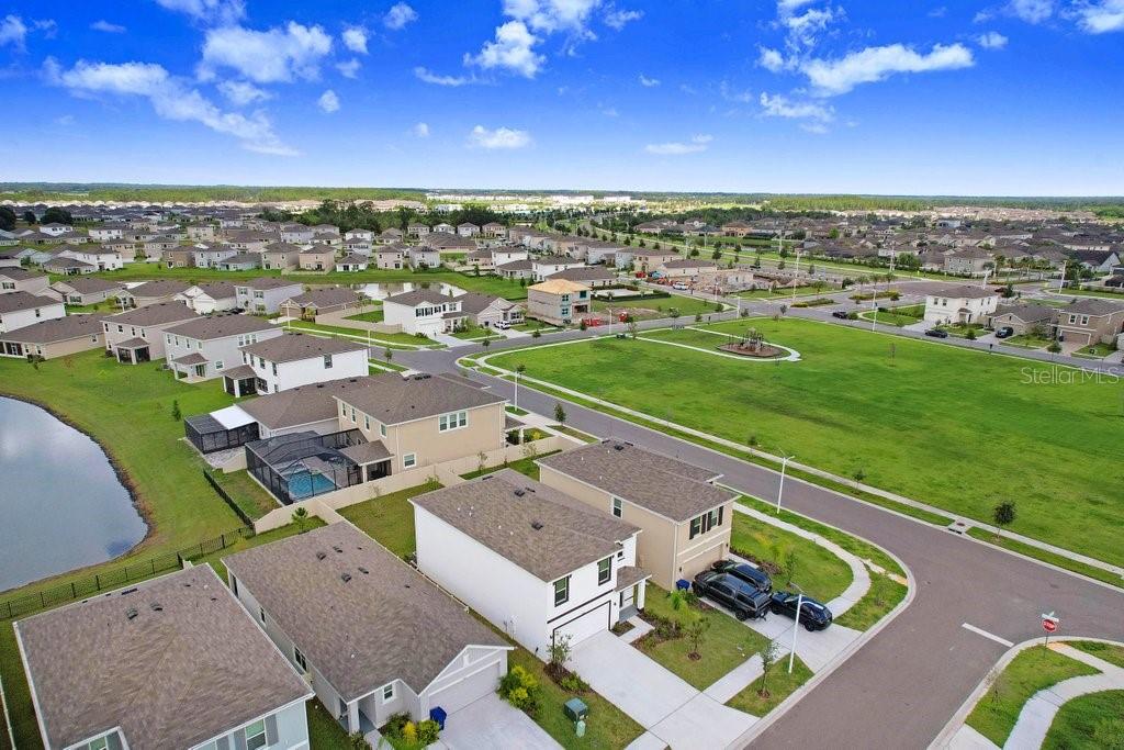 9319 Forge Breeze Loop Wesley Chapel, FL 33545 - Photo 10 of 45 an aerial view of a house with a garden