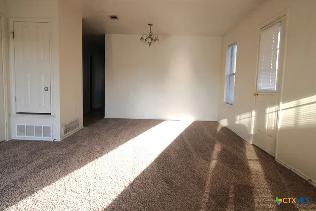 a view of a bedroom window and hallway
