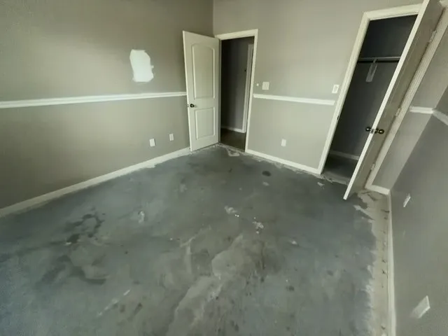 a view of a windows and chandelier in big room