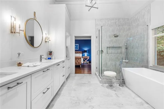 a bedroom with a bed and a mirror