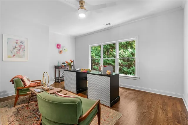 a living room with furniture and kitchen view