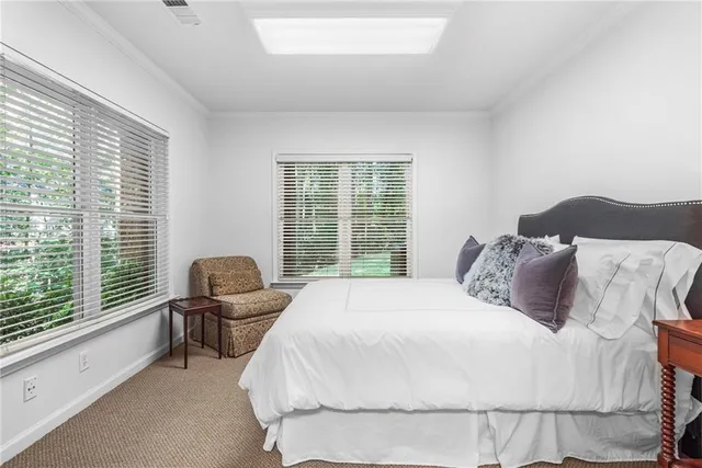 a view of a patio with table and chairs and potted plants