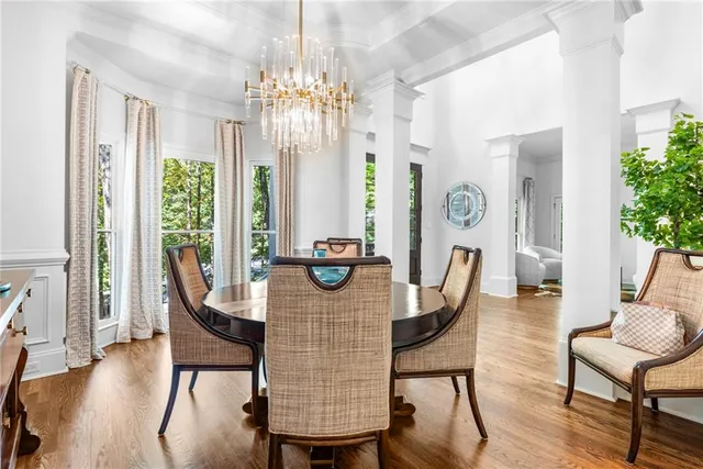 a view of a dining room with furniture window and wooden floor