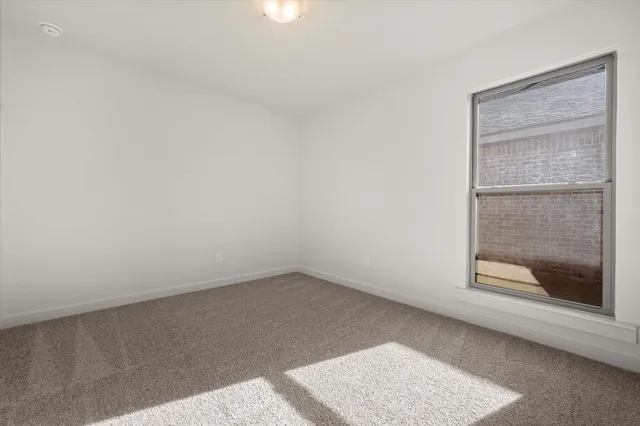 an empty room with a bench