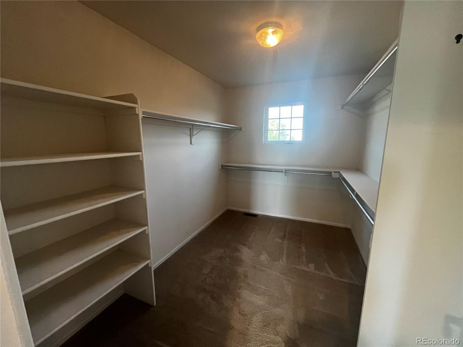 8121 Raspberry Drive Frederick, CO 80504 - Photo 18 of 27 a view of an empty room with a window