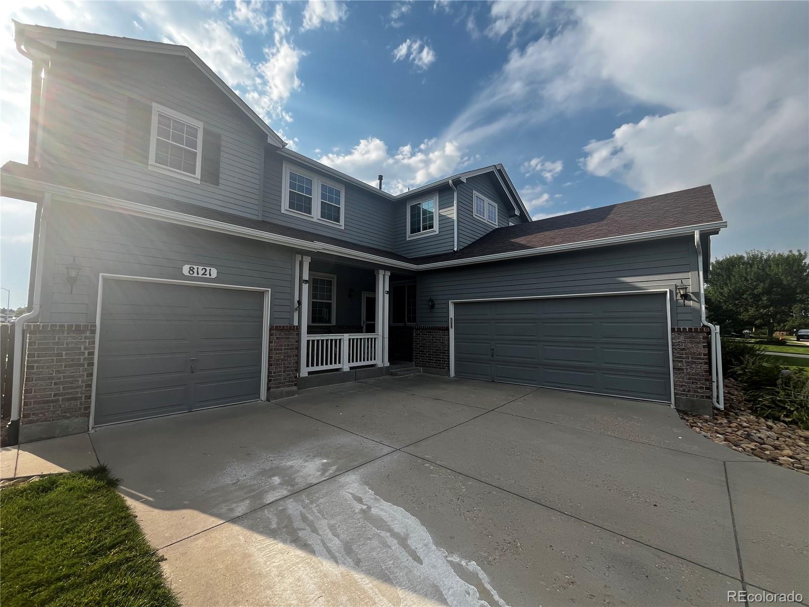 8121 Raspberry Drive Frederick, CO 80504 - Photo 2 of 27 a view of a house with a garage and balcony