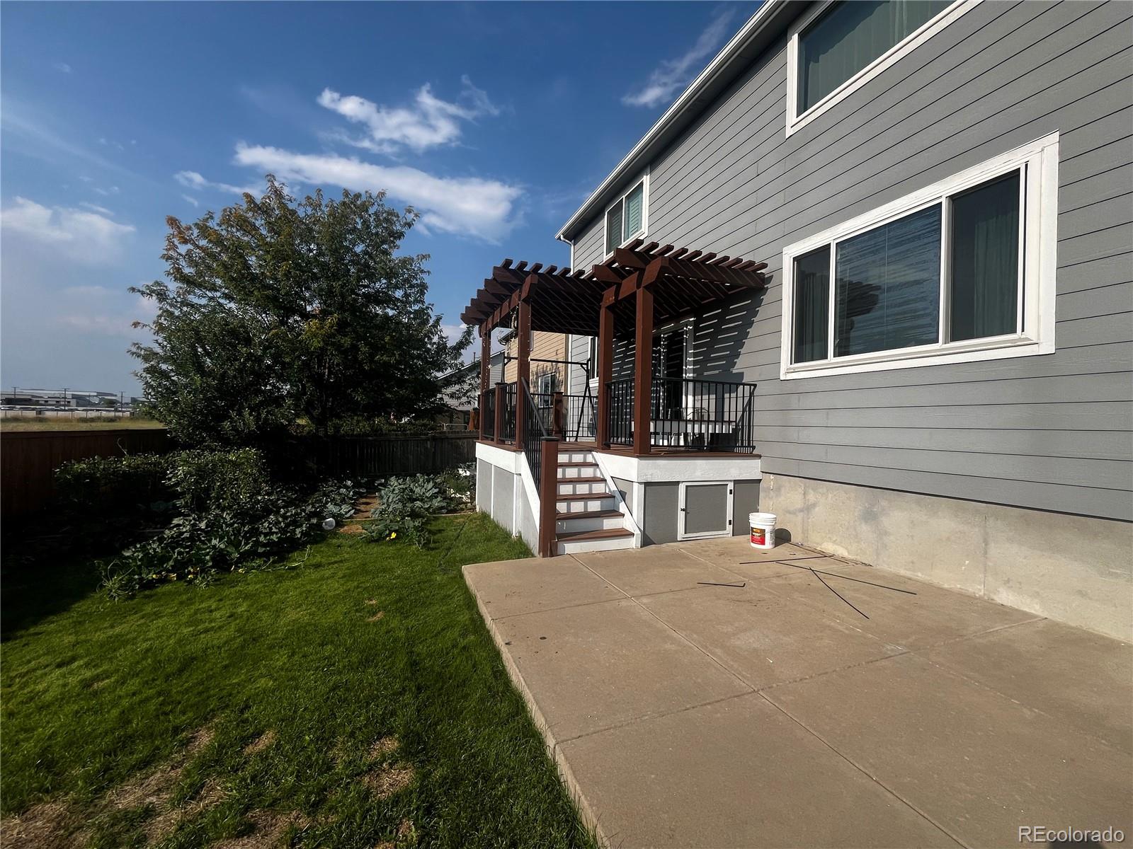 8121 Raspberry Drive Frederick, CO 80504 - Photo 26 of 27 a view of a house with a yard