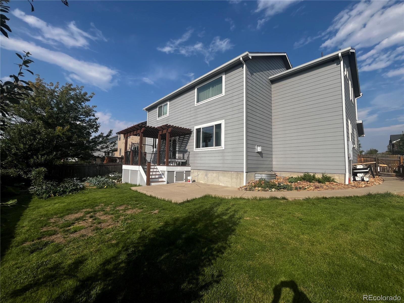 8121 Raspberry Drive Frederick, CO 80504 - Photo 27 of 27 a front view of a house with yard and green space