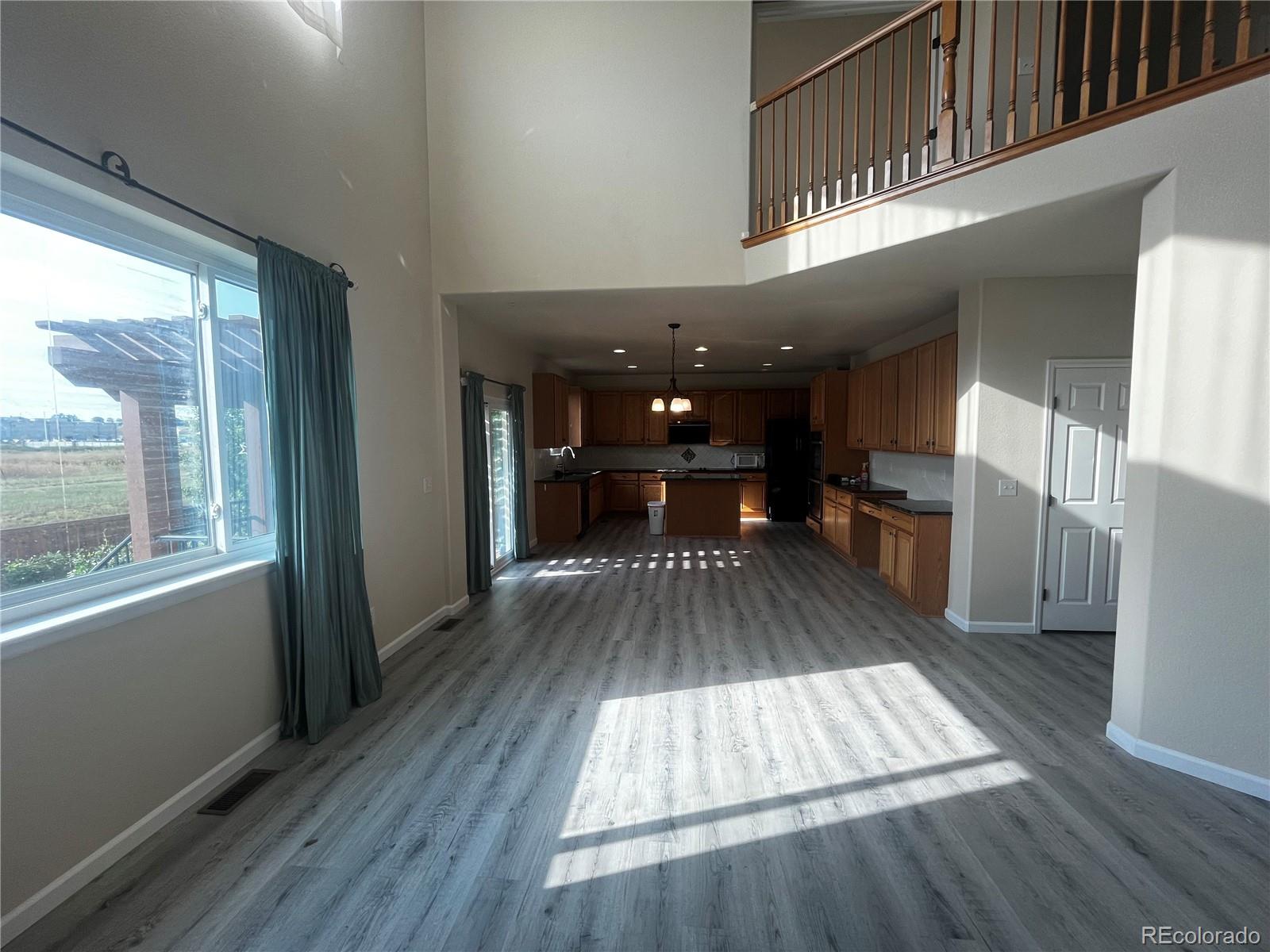 8121 Raspberry Drive Frederick, CO 80504 - Photo 5 of 27 a view of kitchen with furniture and wooden floor