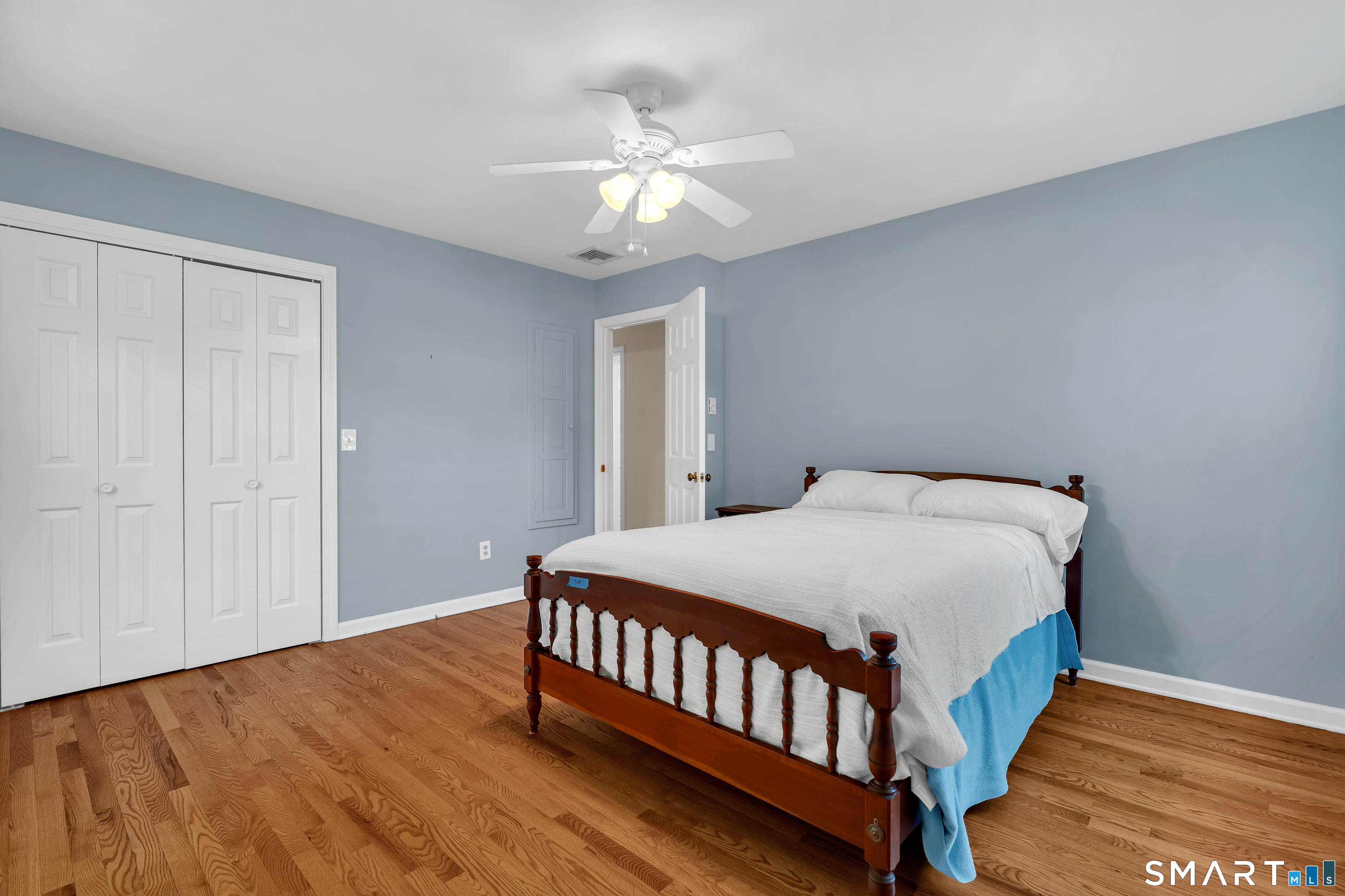 28 Downing Way, Unit 28 Madison, CT 06443 - Photo 16 of 30 Bedroom 2 has ceiling fan, hardwood floors and is a good size.
